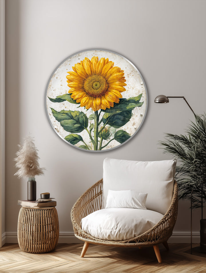 In the foreground, a woven chair and side table create a cozy vignette below the golden sunflower botanical round oil painting art prints.