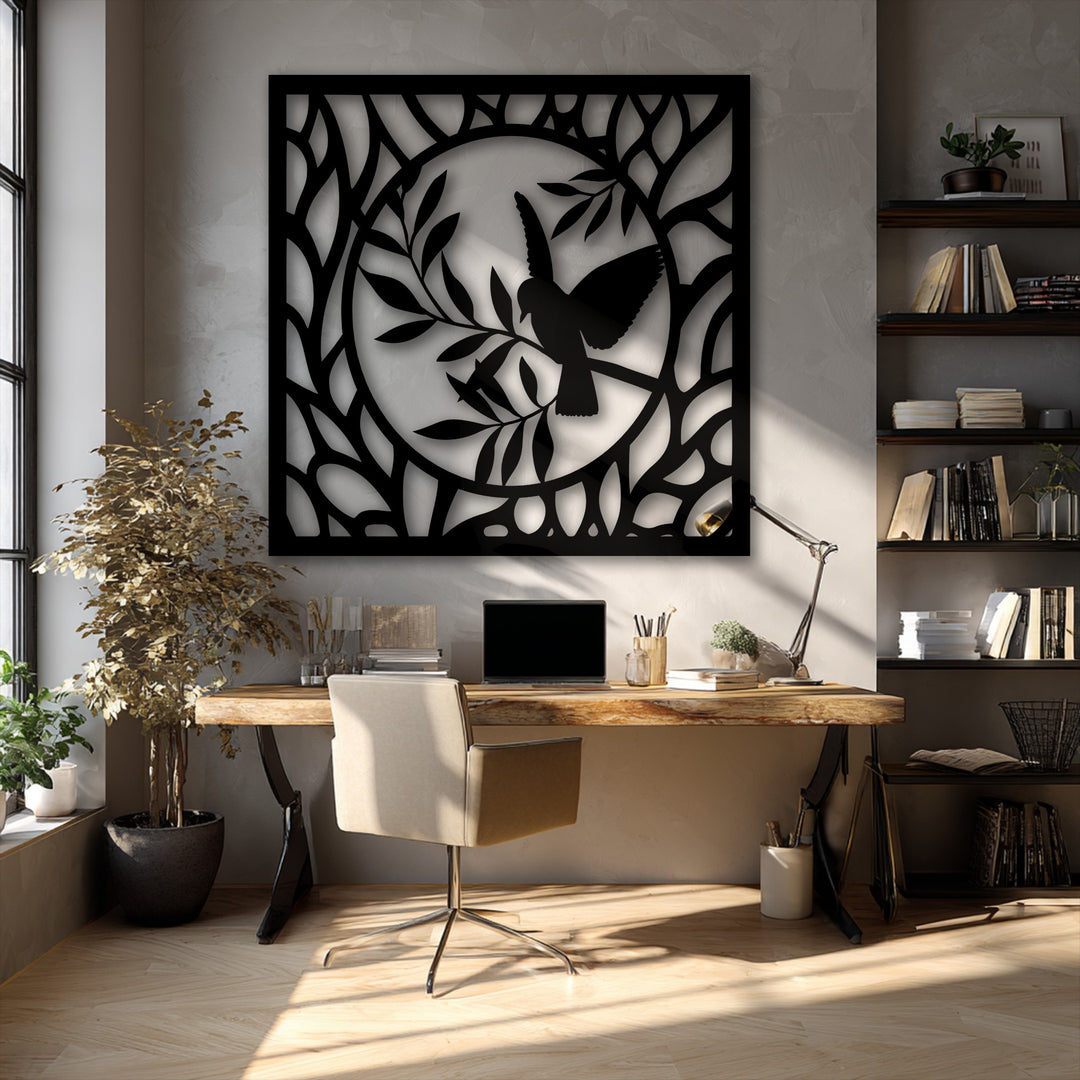 Organic forms of intertwining branches and delicate leaves frame a graceful bird within this elegant circular black metal art for wall.