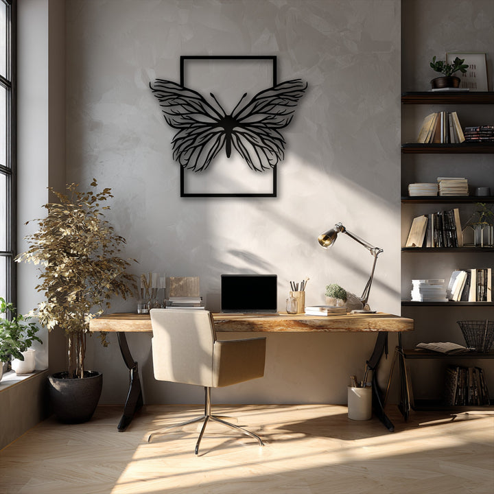 A soft, warm greige tone dominates this modern office, framing a unique metal wall art featuring an intricate butterfly design.