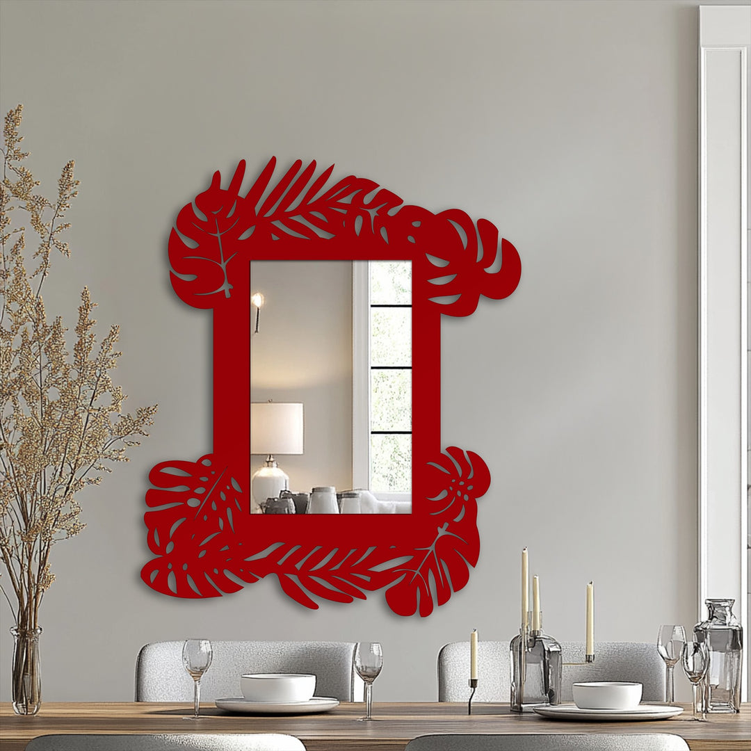 Cascading botanical metal wall decor in a tropical leaf frame bathroom mirror design, suggesting a sense of kinetic energy within the static form.