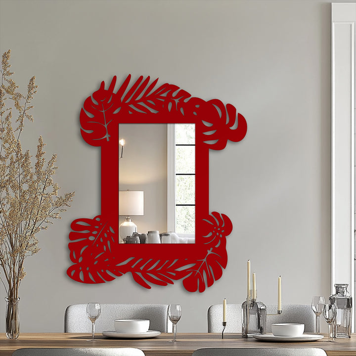 Cascading botanical metal wall decor in a tropical leaf frame bathroom mirror design, suggesting a sense of kinetic energy within the static form.