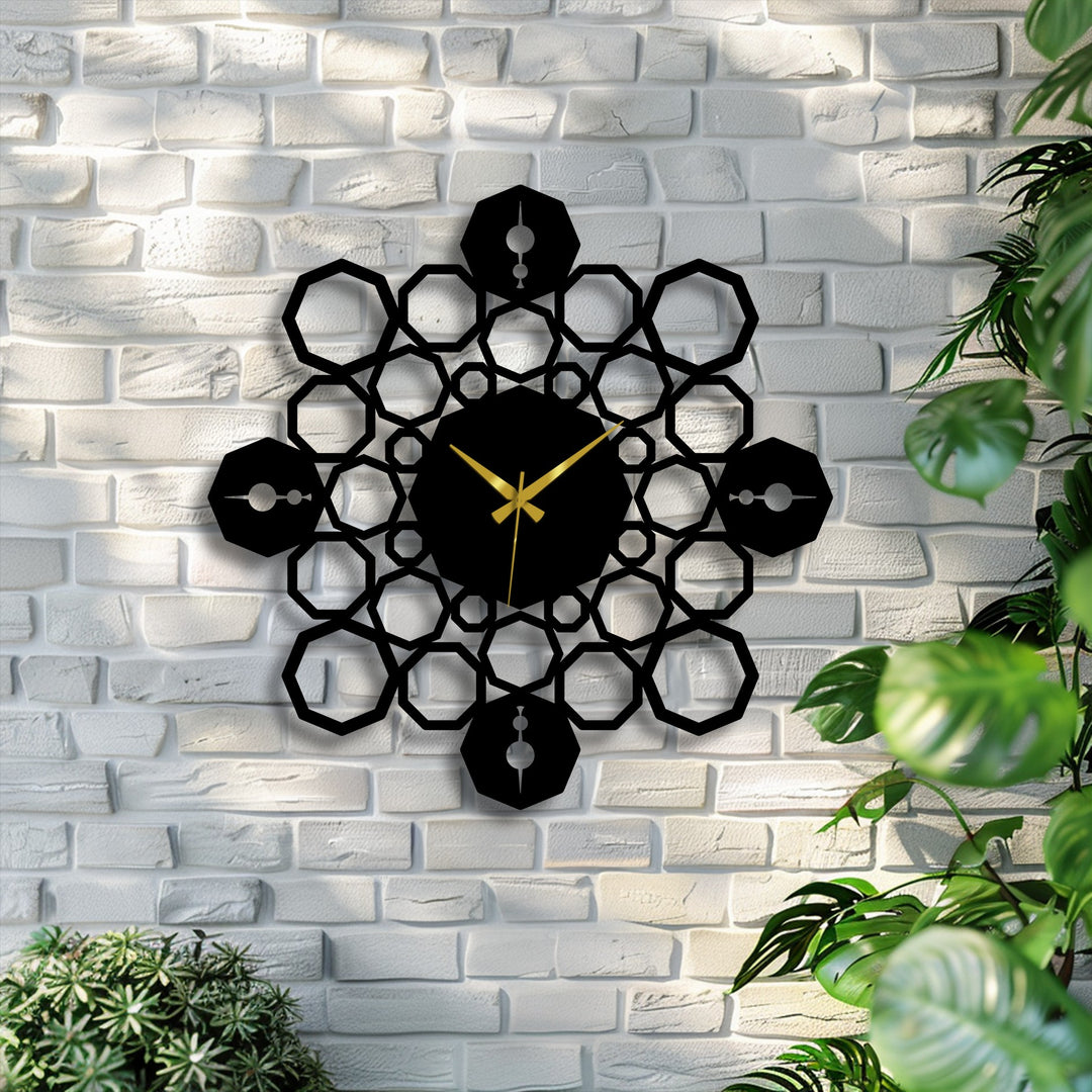 The darkest area, a striking black geometric mandala metal art for wall, displays golden hands at its center against a textured white brick wall.