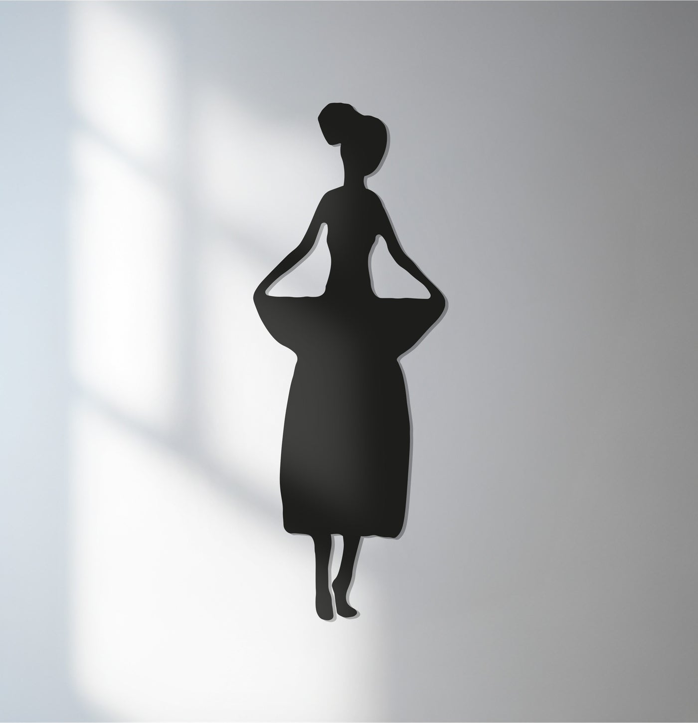 Showcasing the realistic detail of the silhouette in this african woman cultural dance scene, this striking metal wall decor piece offers a contemporary touch.