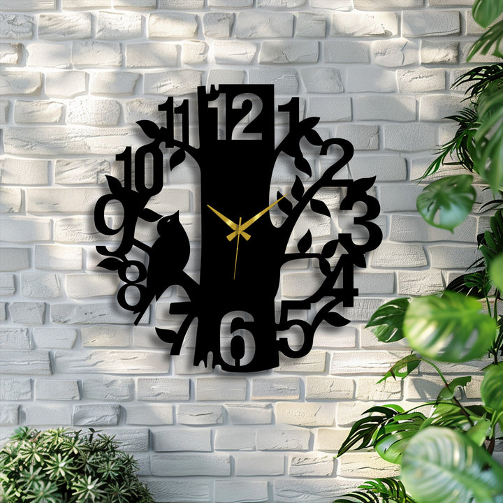 Textured brick provides a rustic surface texture for this laser-cut metal clock depicting a tree with a perched bird, a stunning piece of decoration wall art.