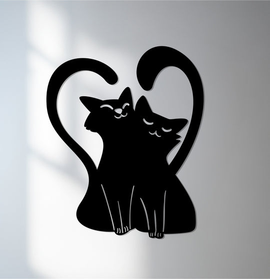 Graceful, interlocking curves create the organic forms of this loving cat couple within a heart in this unique metal wall decor art piece.