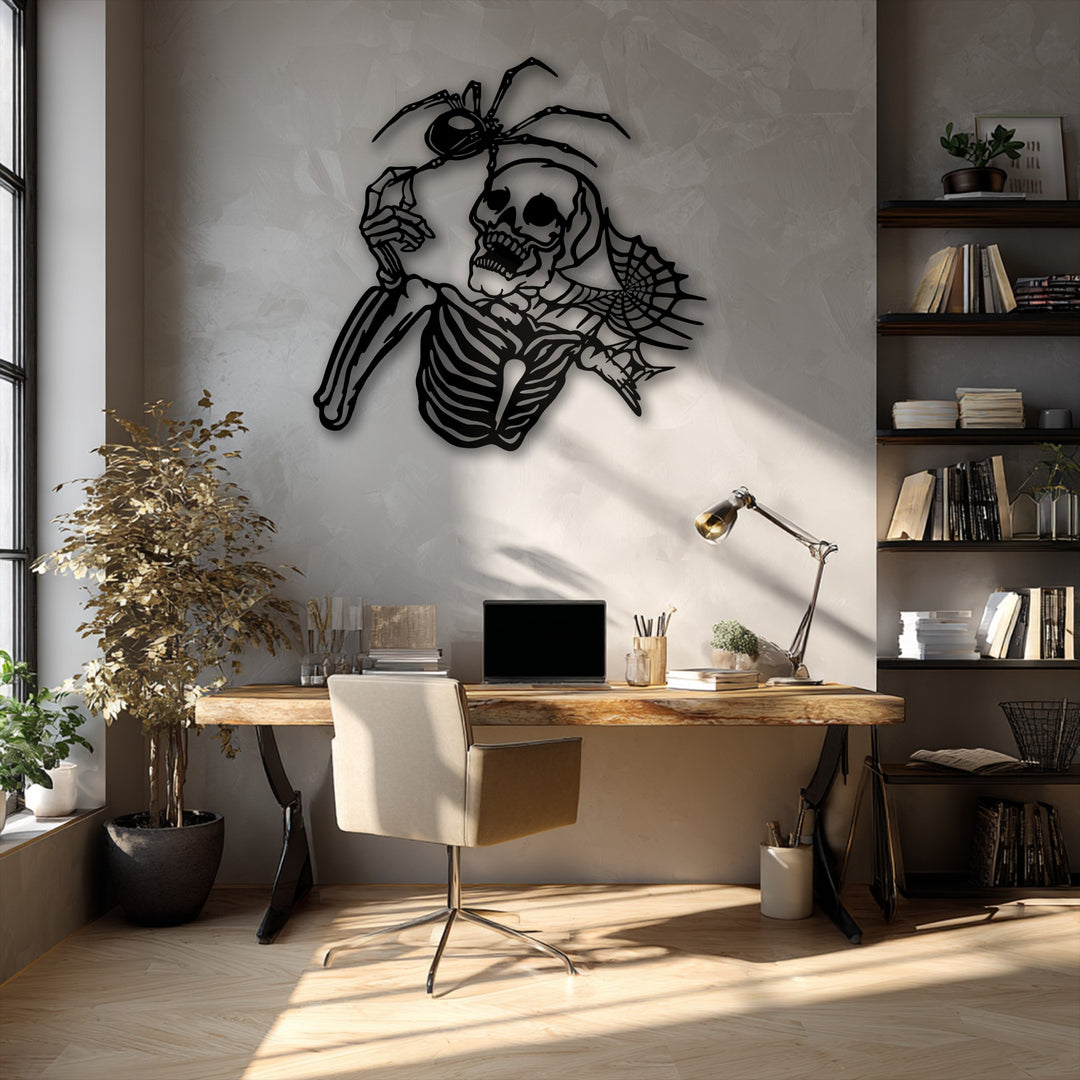 The negative space expertly defines the detailed Gothic Skeleton & Spider metal wall decor, creating a striking shadow effect.