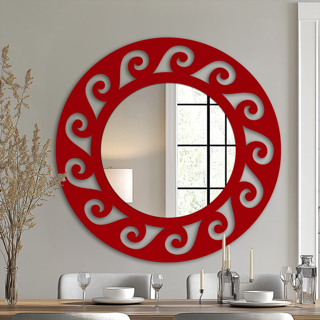 Subtle light and shadow play across this bathroom mirror's decorative metal art frame, emphasizing the ornate scroll design with reflective depth.