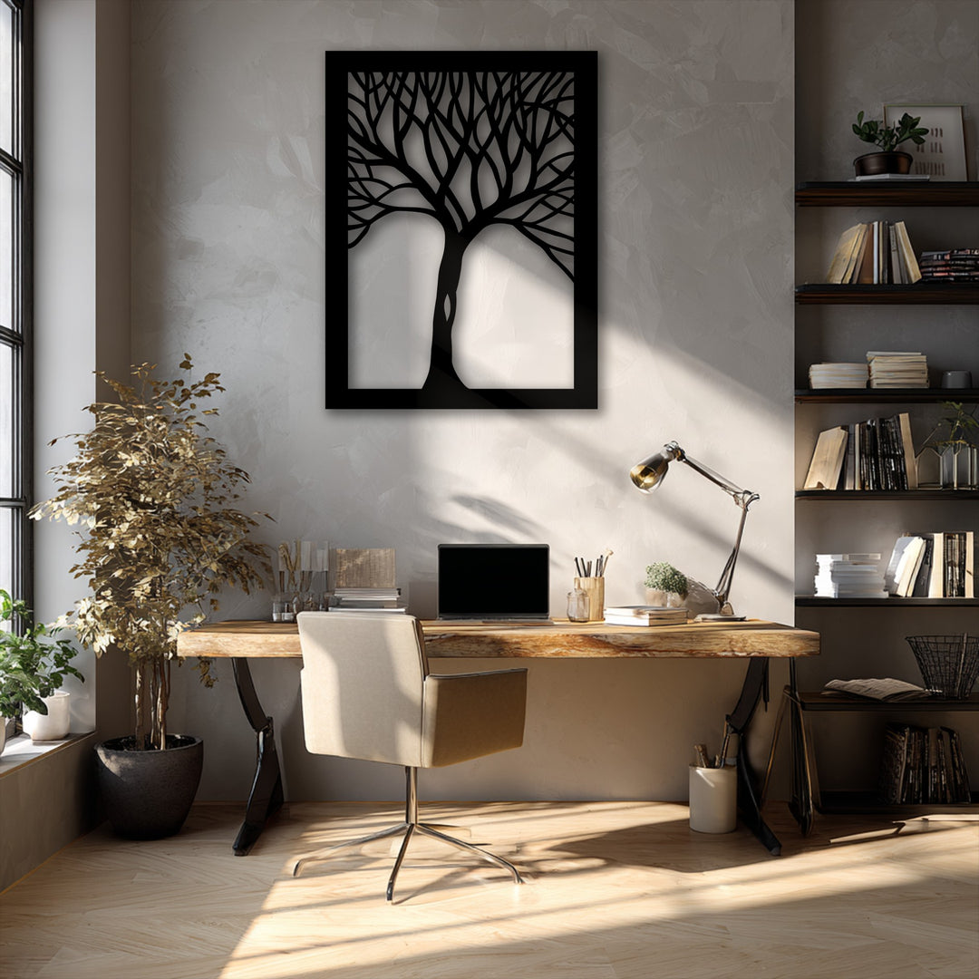 A sunlit rustic wooden desk and beige office chair are arranged in a workspace featuring abstract tree silhouette decorative metal art.