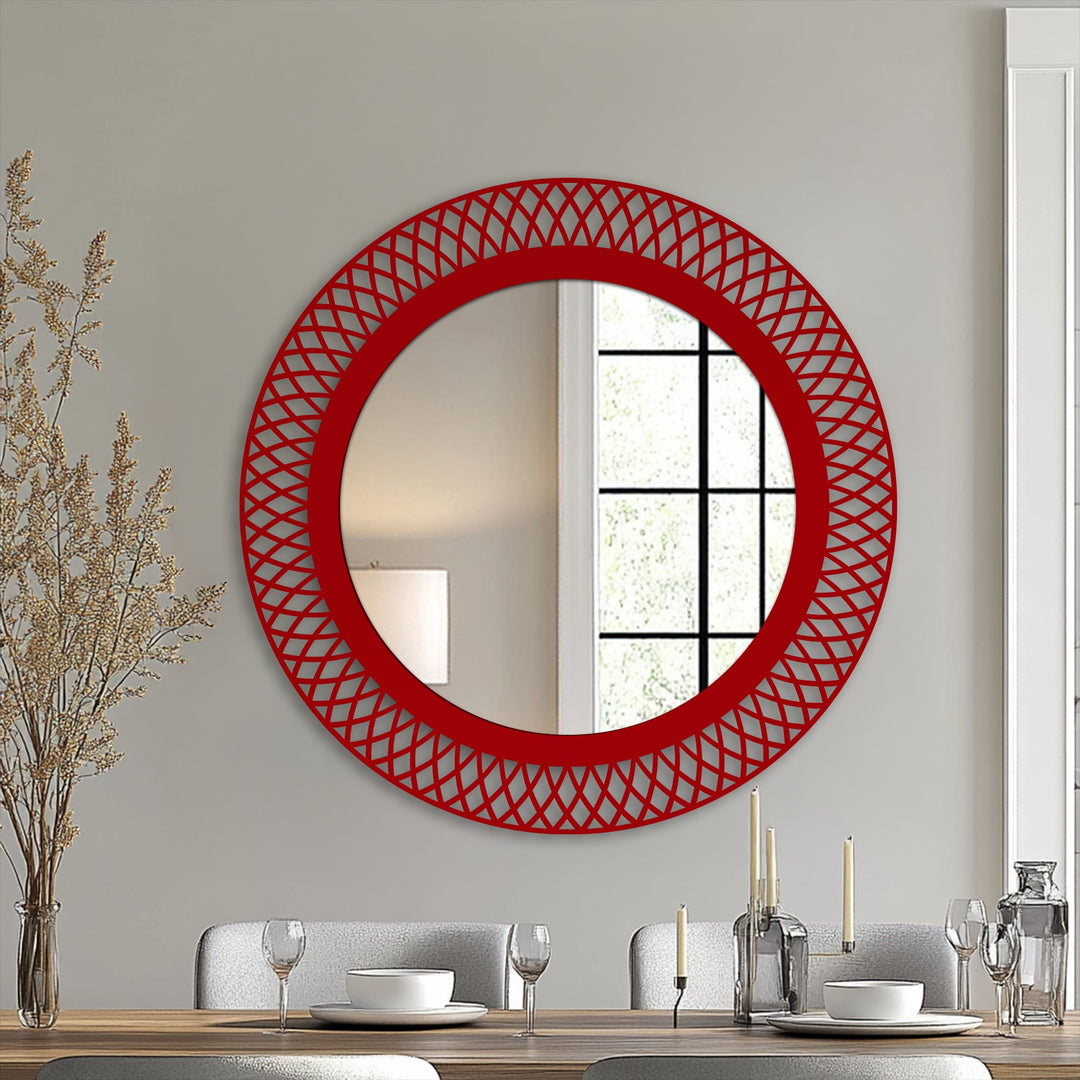 Brightest area in this decorating with wall mirrors image showcases a round, geometric lattice mirror, a statement piece featuring a vibrant red frame.