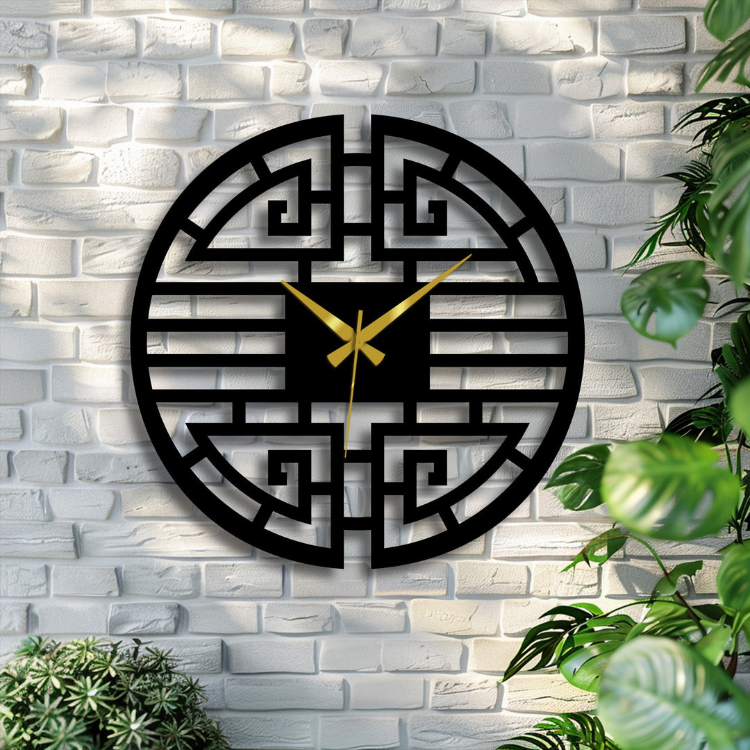 Bold decorative metal art defines the oriental-inspired Asian geometric metal wall clock with its striking black design and contrasting gold hands.