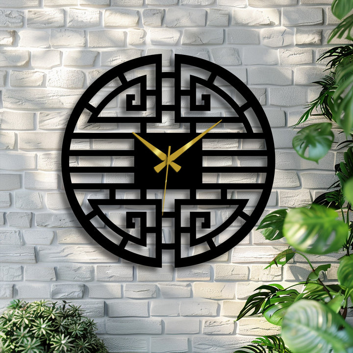 Bold decorative metal art defines the oriental-inspired Asian geometric metal wall clock with its striking black design and contrasting gold hands.