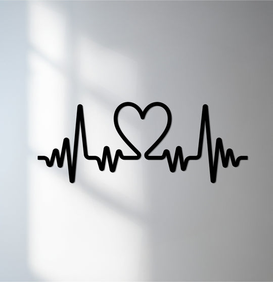 The brightest area illuminates the heartbeat union design of this metal art for wall, accentuating its minimal heart pulse form in sleek black.