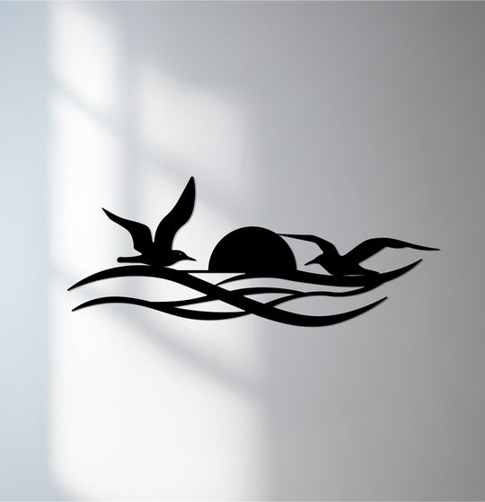 Smooth surface texture is showcased in this silhouette of sunset birds, a modern decorative metal art piece featuring a coastal home décor theme.