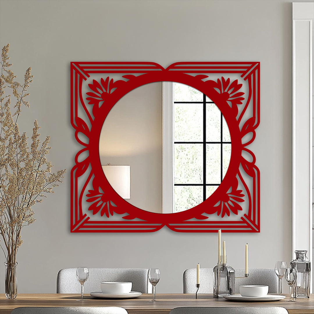 Elegant framed wall mirror features a decorative red floral art deco design as the focal point, offering a unique and stylish accent.