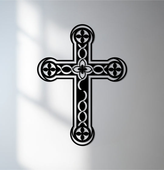 Transitioning from bright to dark, the shadow accentuates the intricate floral details of this Christian Eternal Bloom metal artwork wall cross.