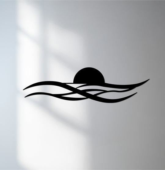 Foreground shows the dark, sleek lines of minimal sunset waves defining this striking metal art for wall, creating a modern coastal decor piece.