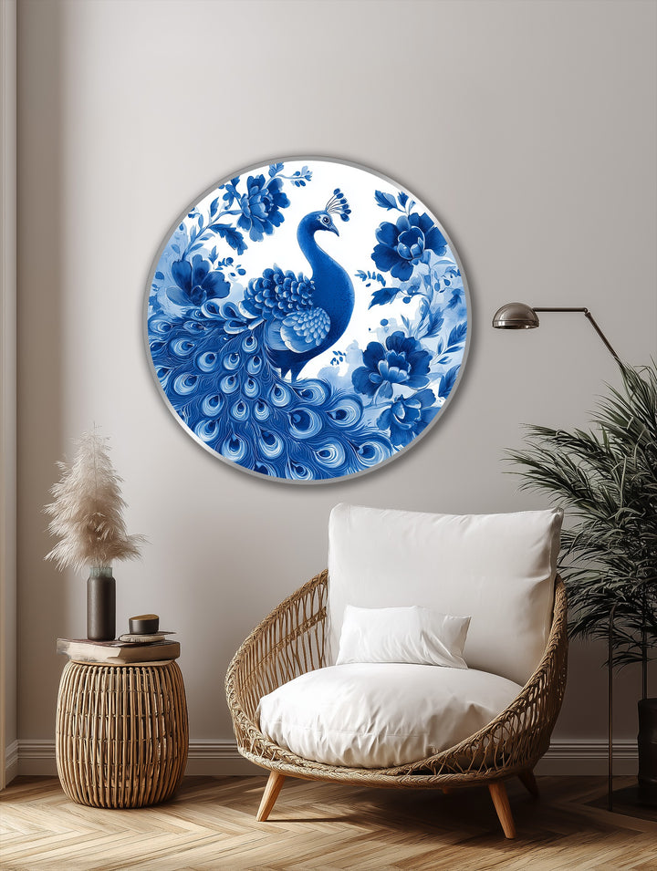 Foreground shows a cozy wicker chair and side table styled near the indigo peacock among blossoms round, representing modern oil painting art.