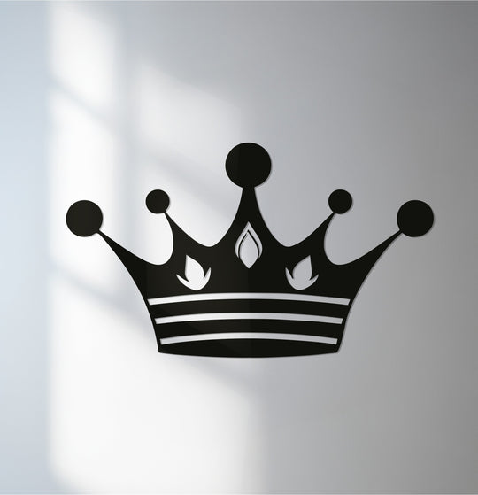 High color contrast showcases the black crown silhouette in this unique metal wall art, a regal design for striking home decor.