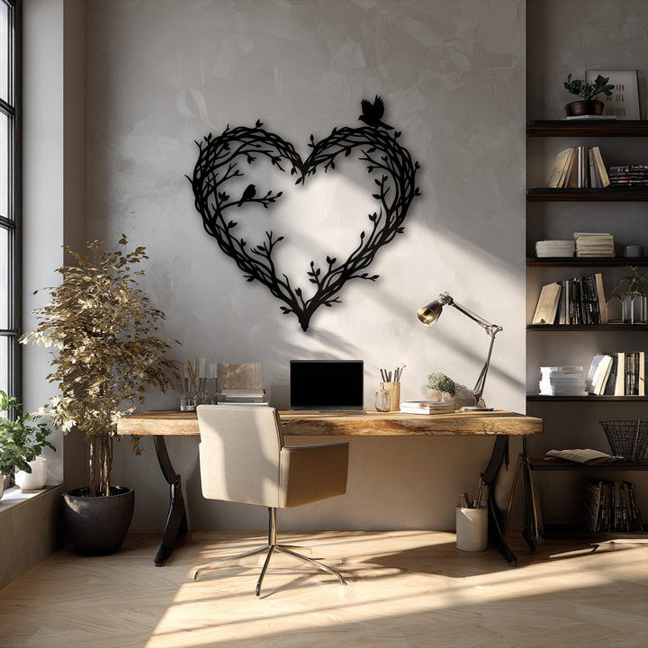 The darkest area reveals a striking heart-shaped bird and branch metal artwork, prominently displayed against the textured wall.