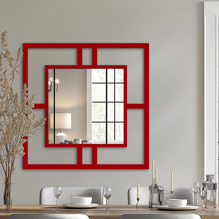 Bold red geometric framing makes this modern square metal wall mirror a striking mirror for wall decor and an architectural accent.