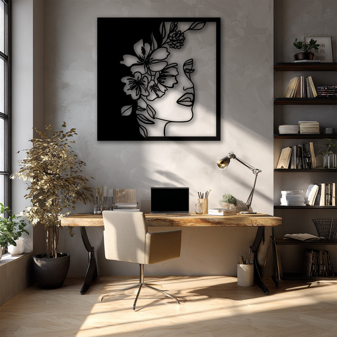 The warm sunlight illuminating the room creates a comfortable color temperature, highlighting the elegant Floral Woman Line Art, a unique metal wall art piece.