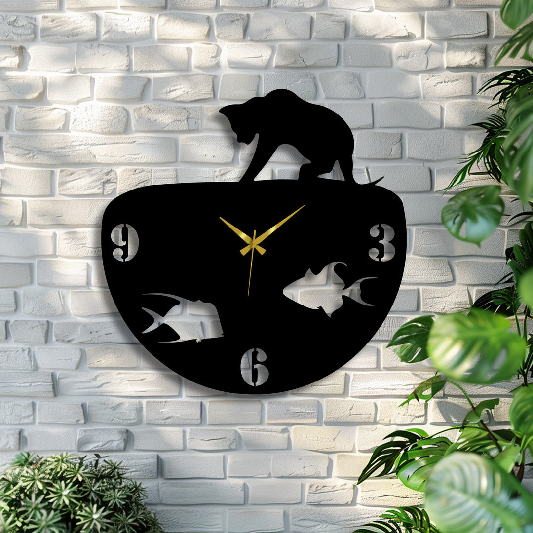 Highlighting depth and layers, a unique metal wall art cat and fish bowl clock stands against a white brick wall, framed by green plants.