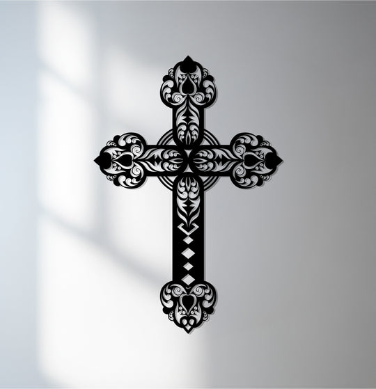 Textured decoration wall art highlights the ornate cross metal wall art's laser-cut precision, creating shadows that accentuate its metallic finish.
