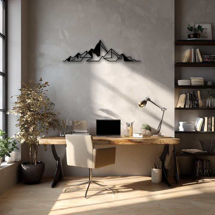 The black, geometric abstract mountain line decorative metal art creates a stark contrast against the light wall, defining the darkest area.