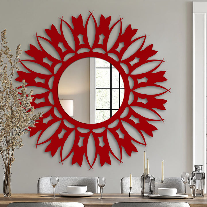 Vertically oriented, this round modern mirror features an elaborate floral sunburst shape with a vibrant red frame.