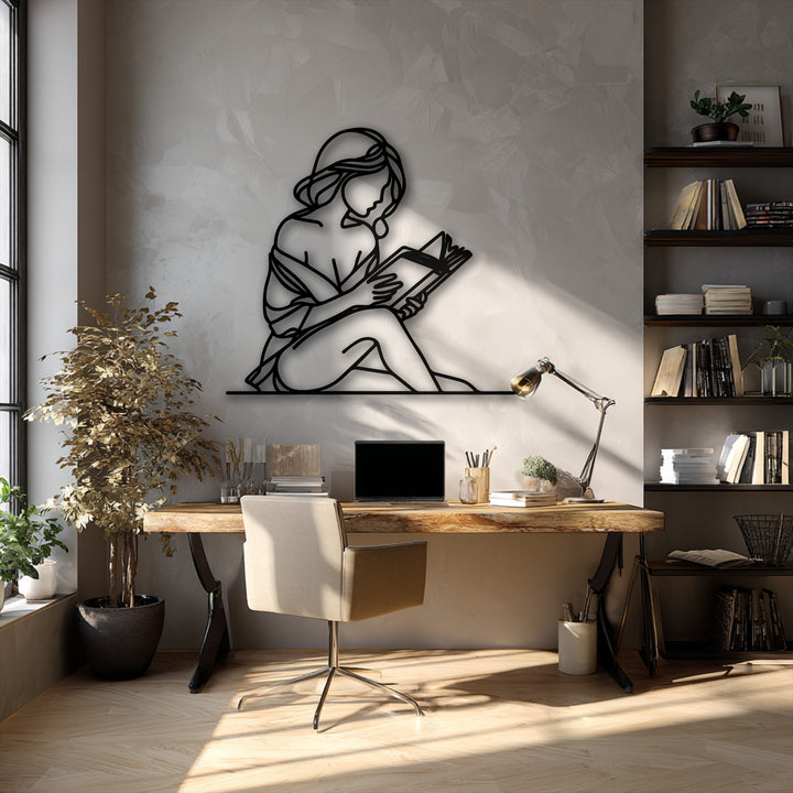 A horizontal quiet reader silhouette metal wall decor depicting a minimal woman's elegant and relaxed shape.