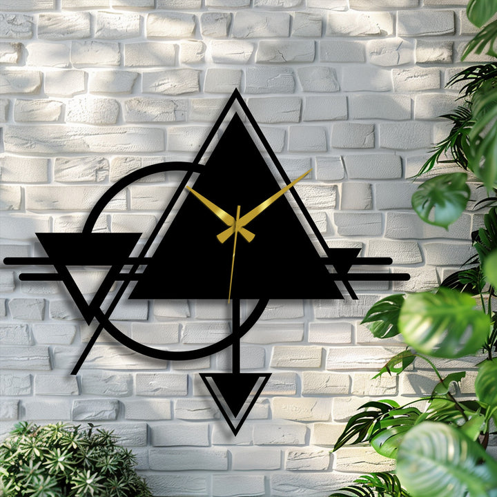 Color contrasts highlight the striking geometric metal artwork clock, where deep black shapes meet the brass hands in a bold transition.