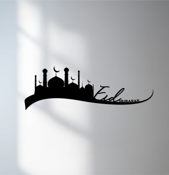 Observing the subtle transition between colors on the wall behind this Islamic metal wall decor depicting an Eid Mubarak skyline.