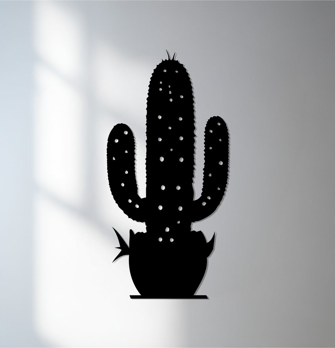Black is the dominant color in this decorative metal art depicting a cactus, a modern wall decor botanical design.