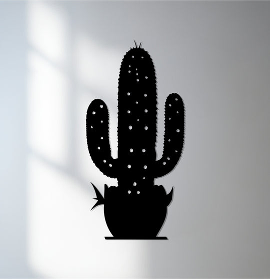Black is the dominant color in this decorative metal art depicting a cactus, a modern wall decor botanical design.