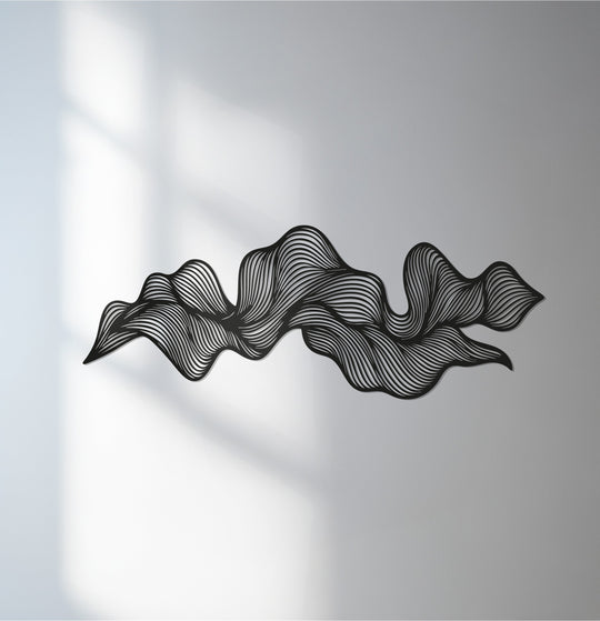 Sunlit wall showcases the decoration wall art, a wavy flow metal wall art, its modern abstract black sculpture casting a subtle shadow.