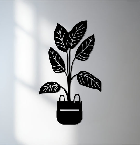 Illuminated by the brightest area, this modern potted plant decoration wall art exemplifies botanical minimalist decor crafted in metal.