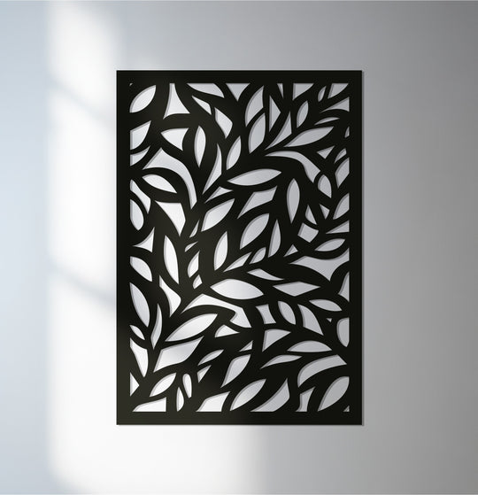 Soft, diffused light graces the unique metal wall art panel, highlighting the botanical leaf sculpture's intricate design and adding subtle depth.