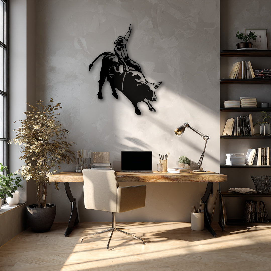 Focusing on the negative space, a striking black metal wall decor depicts a rodeo cowboy on a bucking bull silhouette against a light wall.