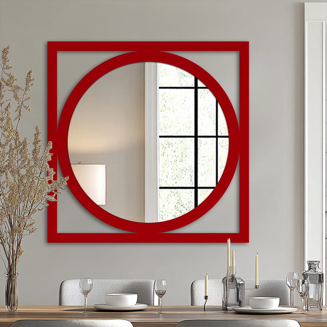 Negative space accentuates the modern square frame round mirror, offering a visually striking mirror for wall decor in shades of grey, white, and red.