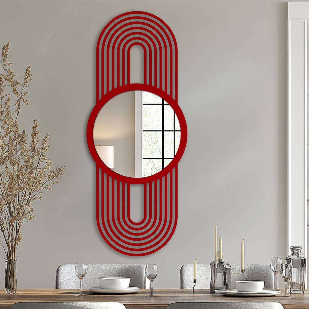 Visual rhythm is created in this red framed wall mirror through the repeating arch lines surrounding the circular mirror.