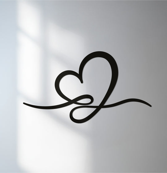 Smooth surface texture highlights the heart line minimalist love metal wall decor, casting a subtle shadow that accentuates its elegant, modern design.