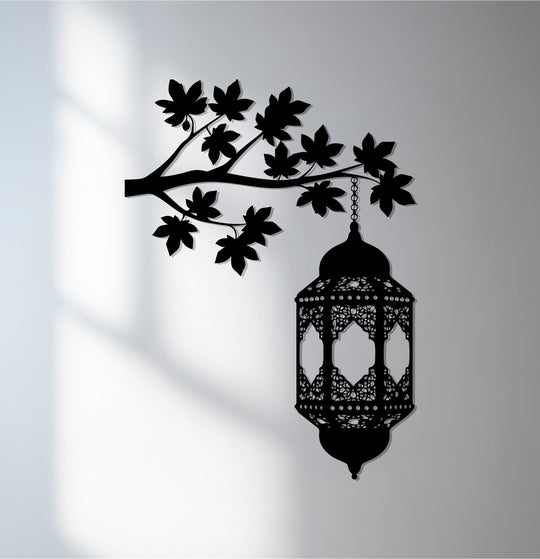Vertically oriented hanging Ramadan lantern unique metal wall art features an intricate Islamic tree branch design.