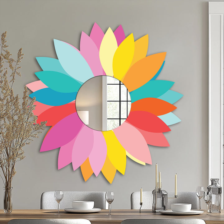 Negative space around the vibrant petals of this colorful floral design highlights the round, modern mirror, creating an eye-catching piece of metal wall decor.