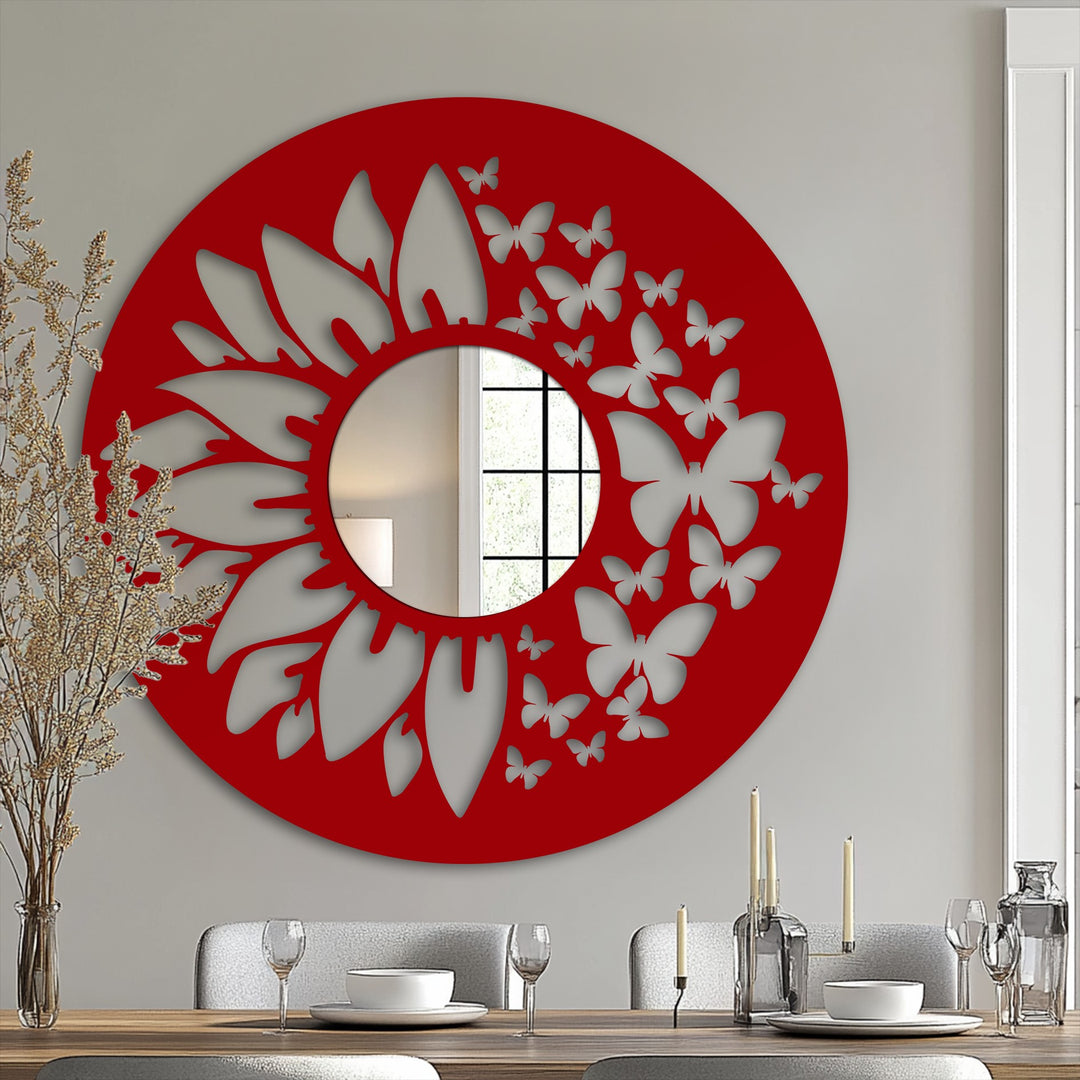 Foreground dinnerware and glassware sit on a wooden table beneath a striking red butterfly and floral mirror for wall decor, adding an artistic touch to the dining room.