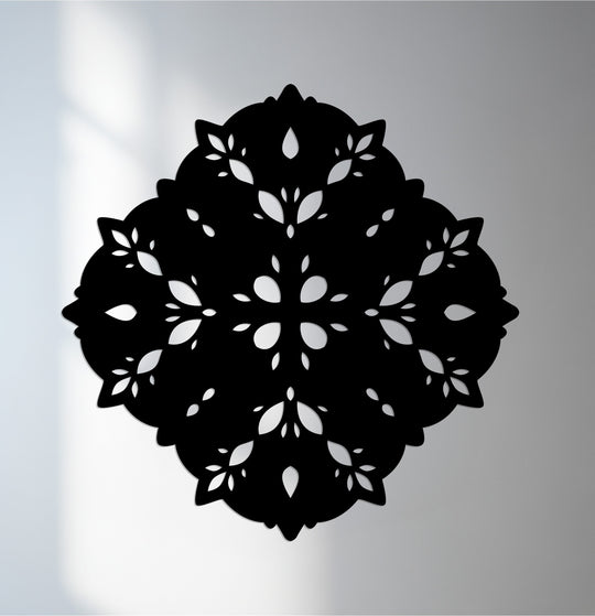 Laser-cut decorative metal art borders frame the intricate floral mandala design of this elegant wall accent piece.