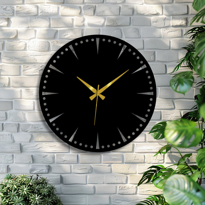 Highlighting the minimalist black surface, this modern metal artwork clock features gold hands on a decorative dial, adding a touch of luxury to any room.