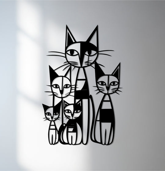Textured metal wall decor showcases the abstract cat family art, where the geometric designs create a tactile, modern surface.