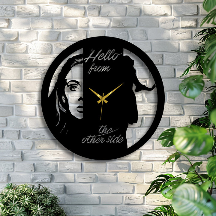 Suggesting movement, the dual face metal artwork clock captures the illusion of shifting perspectives in its artistic portrait silhouette.