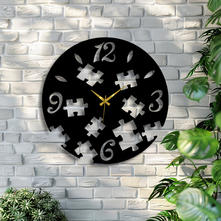 Branches of verdant plants curve beside the unique metal wall art puzzle clock, its fractured silhouette resembling free-form leaves against the brick.
