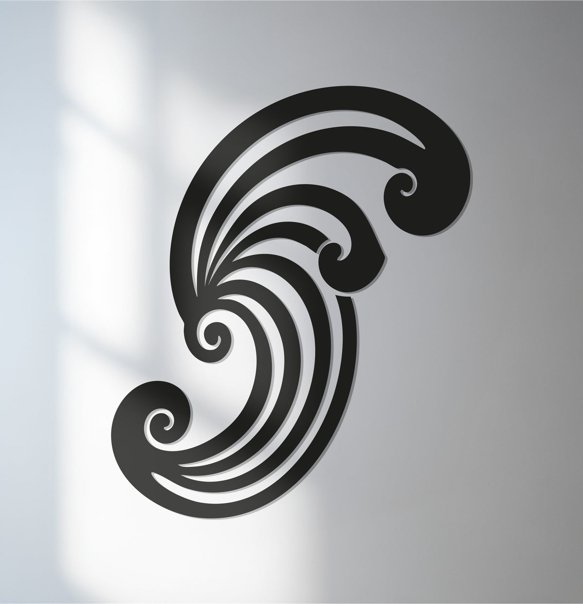 The darkest area highlights the sculpted design of this swirl spiral metal artwork, a striking abstract black metal sculpture.